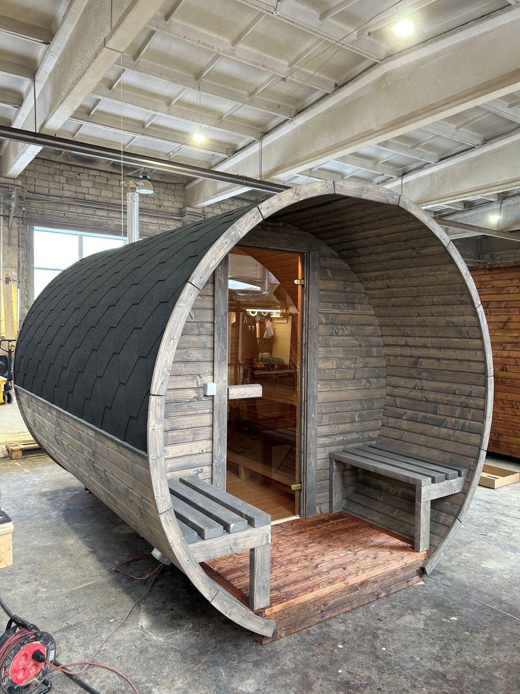 A barrel sauna takes shape in the workshop